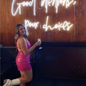 Hot pink faux leather dress.